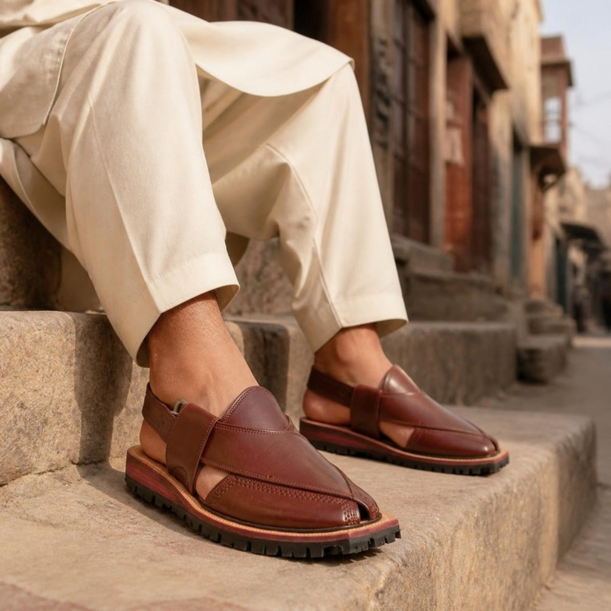 Man wearing a brown leather Norozi chappal with shalwar kameez – Wahjee men's footwear